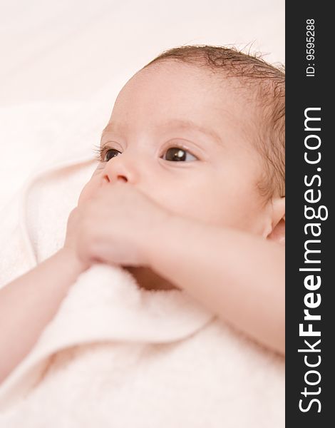 Three-month old baby girl in towel