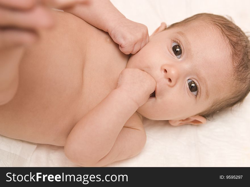 Three-month old baby girl in towel