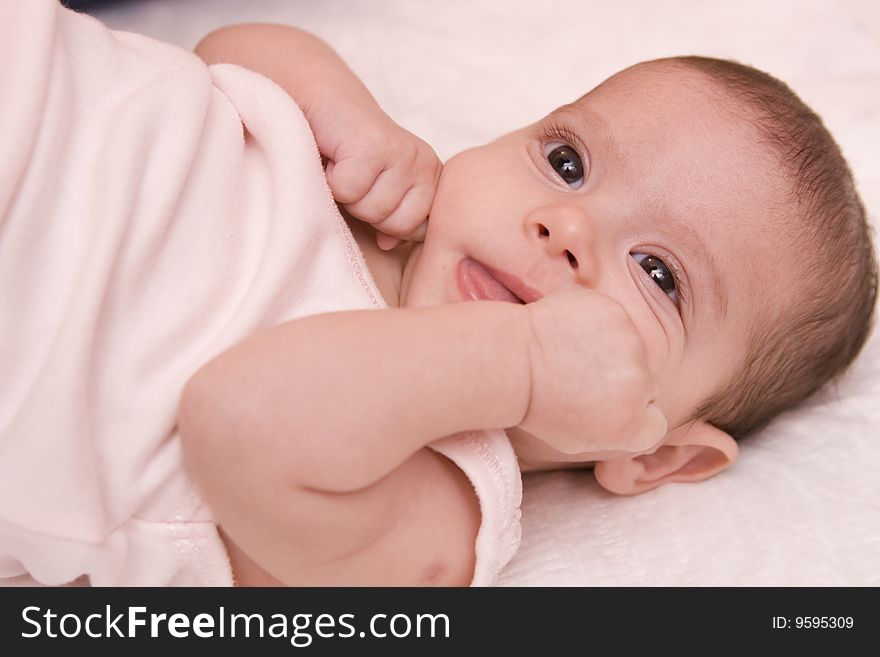 Three-month old baby girl in towel