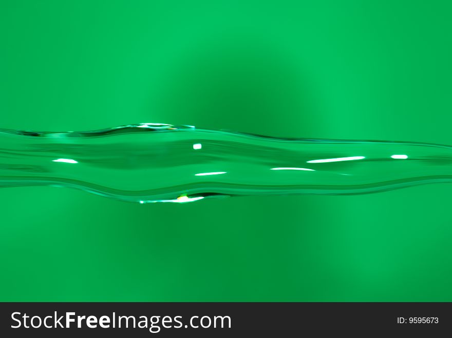 Water flowing over green background. Water flowing over green background