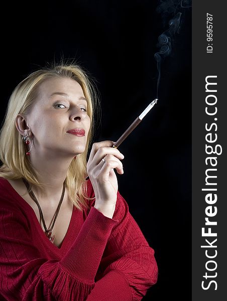 Beautiful blond woman in red with cigarette