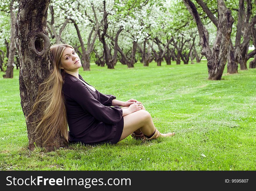 Young woman in the spring garden, day shot