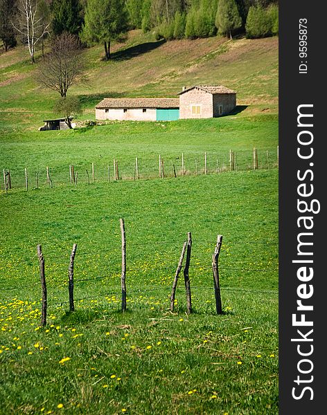 Farm and fields in italian countryside