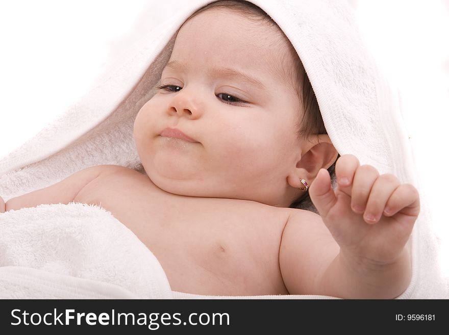 Three-month old baby girl in towel