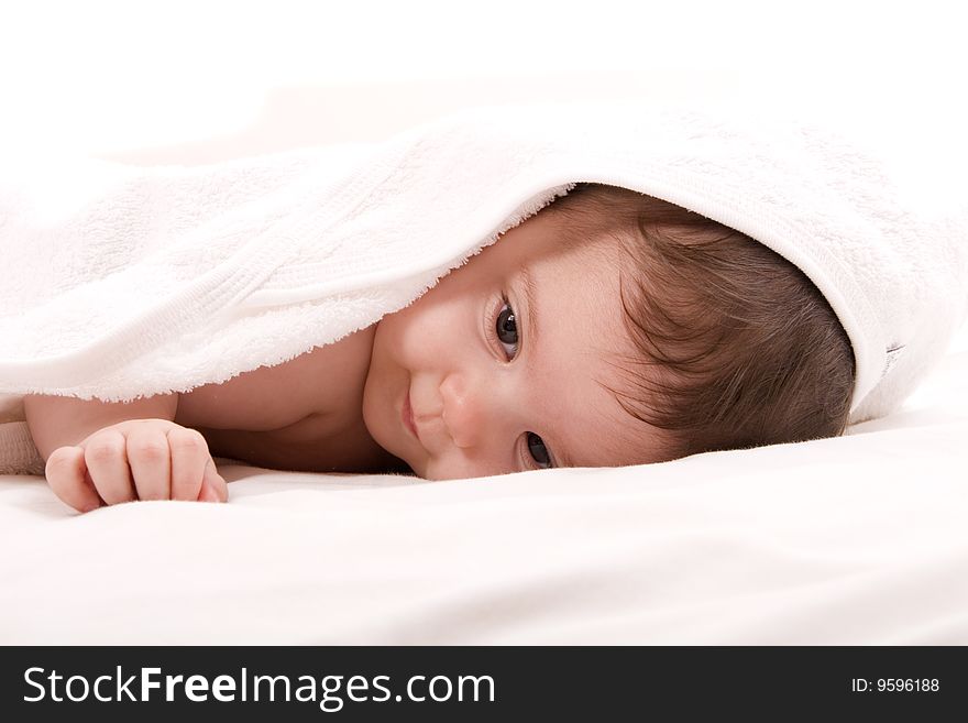 Three-month old baby girl in towel