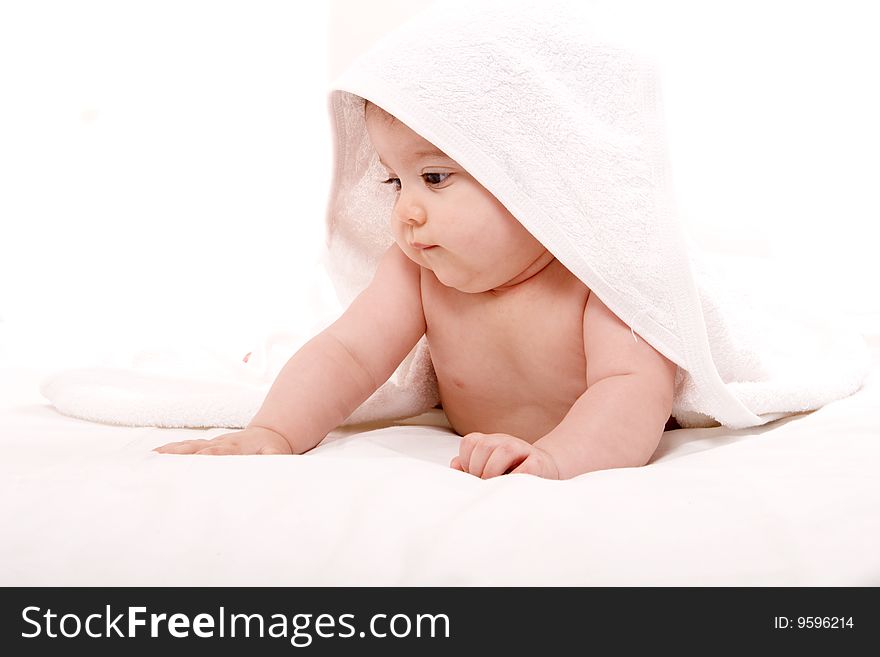 Three-month old baby girl in towel