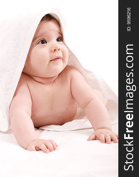 Three-month old baby girl in towel