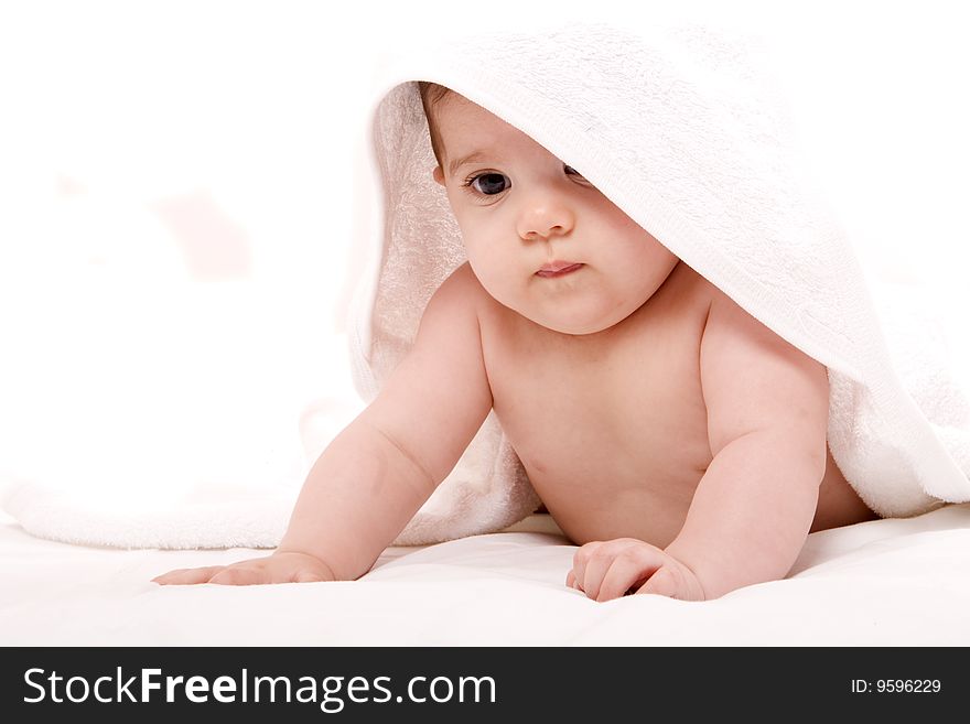 Three-month old baby girl in towel