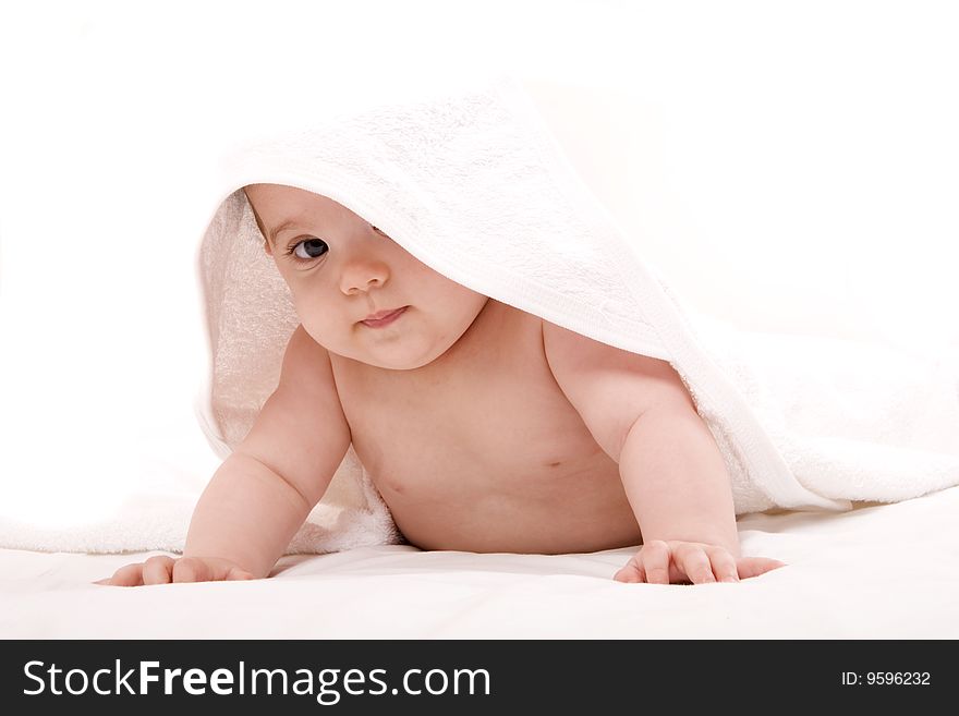 Three-month old baby girl in towel