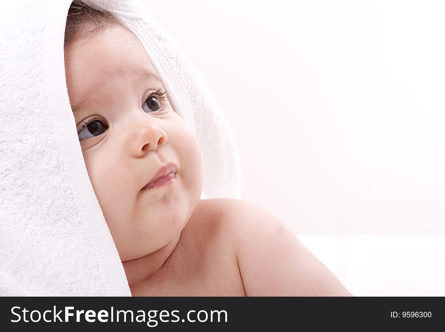 Three-month old baby girl in towel