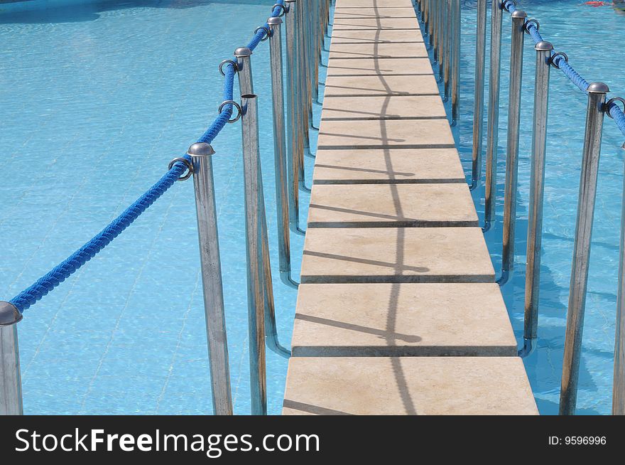 Suspension bridge in pool of hotel. Suspension bridge in pool of hotel