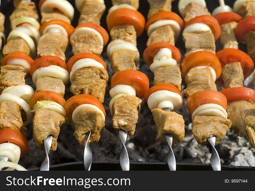 Preparation of meat slices in sauce on fire. Preparation of meat slices in sauce on fire