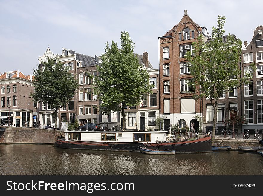 Canal scene with houseboat, Amsterdam