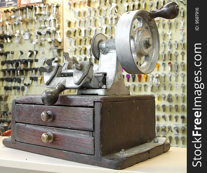 Old manual key duplicating machine in workshop