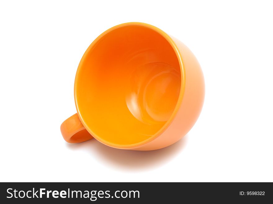 Beautiful orange cup on a white background