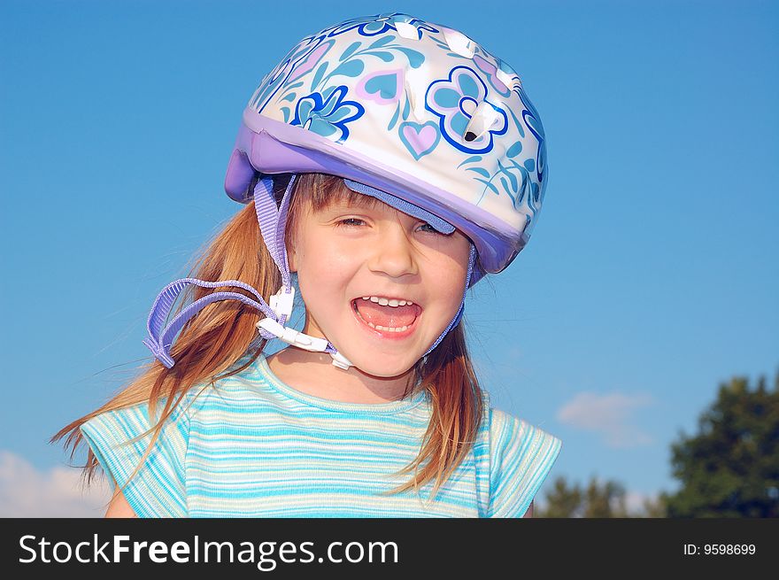 Four year old child wearing a protective helmet. Four year old child wearing a protective helmet.