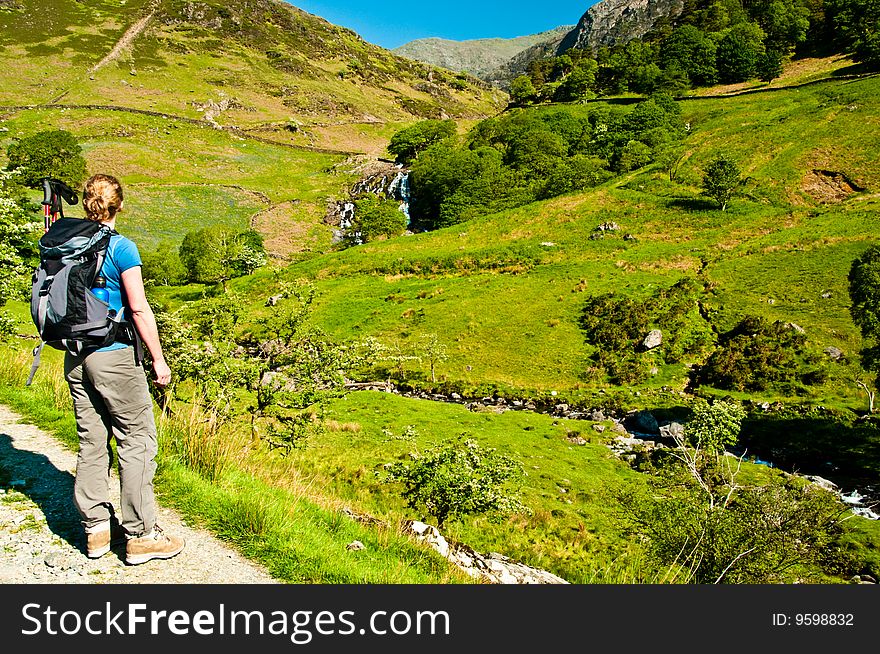 Woman looking up the Watkin Path to Snowdon ridge. Woman looking up the Watkin Path to Snowdon ridge
