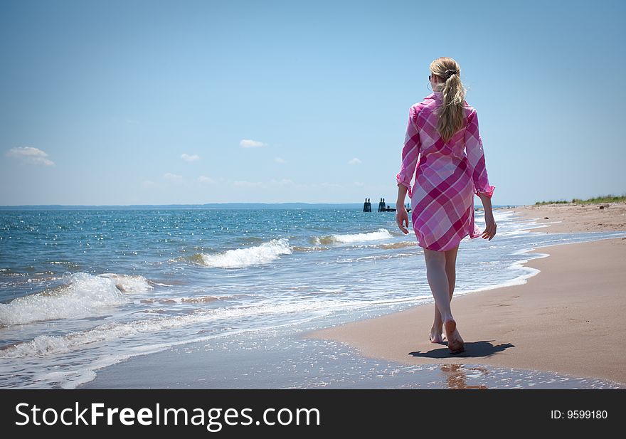 Woman walking on the beach. Woman walking on the beach
