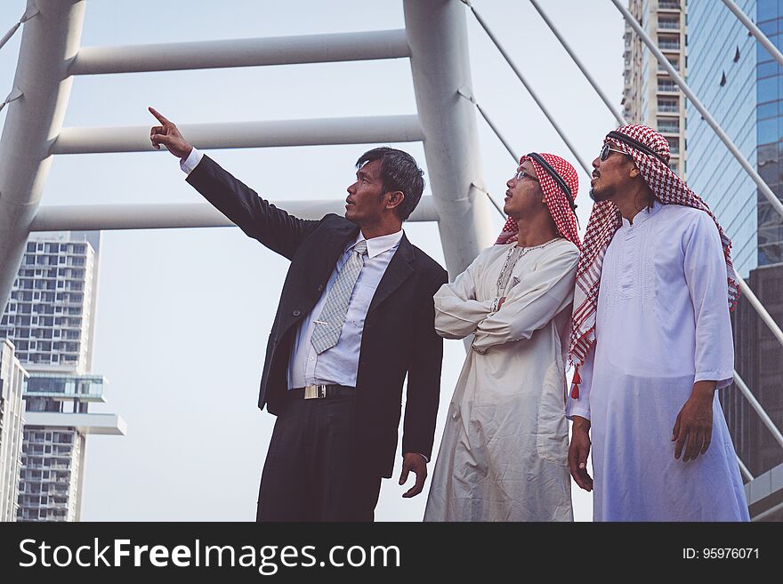 Businessman and Arab businessmen worker on construction site.