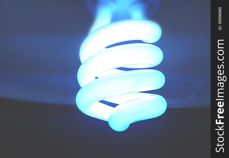 A glowing fluorescent light bulb.