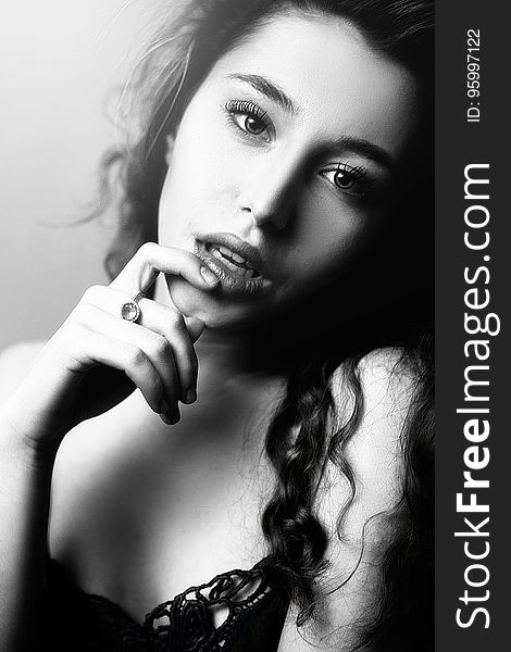A black and white portrait of a woman with a sensual expression. A black and white portrait of a woman with a sensual expression.