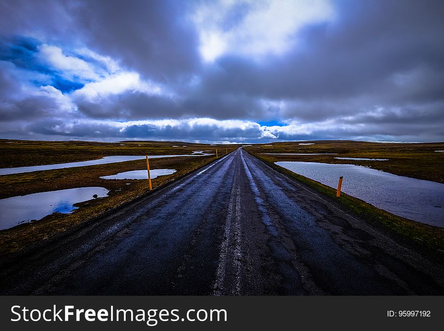 Road through flooded landscape