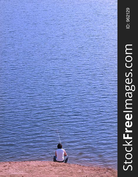 Lonely man fishing in summer. Lonely man fishing in summer