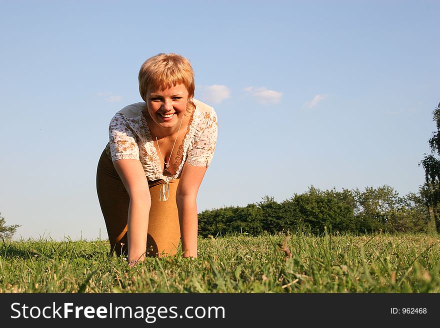 Girl all fours on meadow