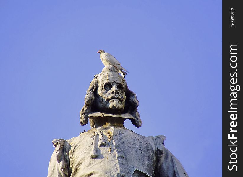 A dove on the head of the famous poet