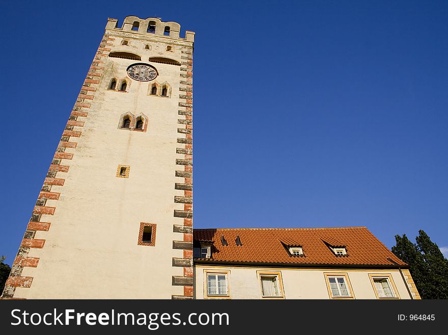 Old clock tower on blue sky. Old clock tower on blue sky