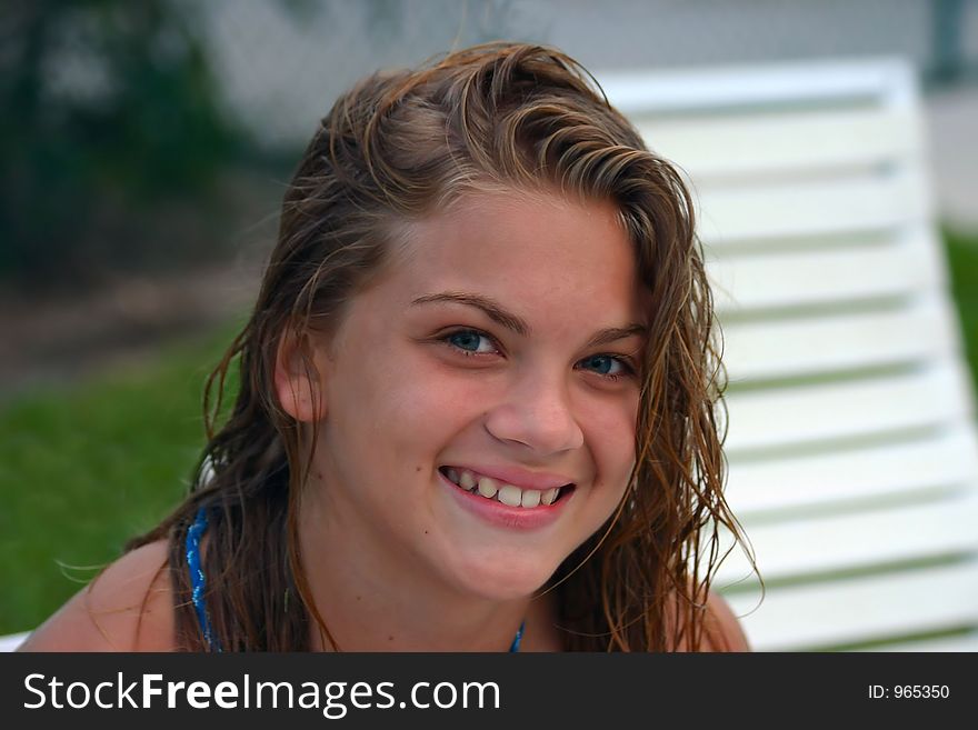 Young lady with wet hair smiling