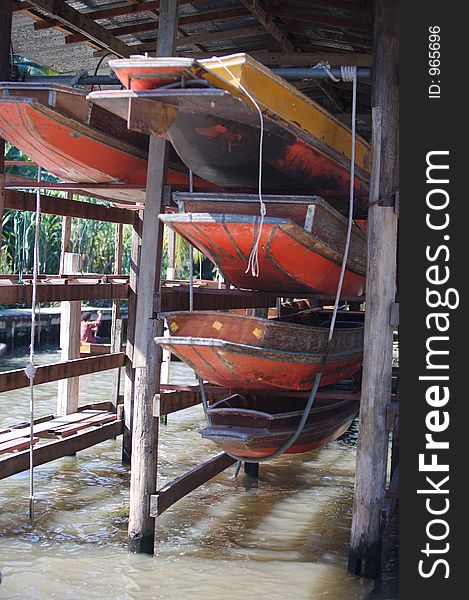 View of the famous floating market boats in Thailand. View of the famous floating market boats in Thailand.