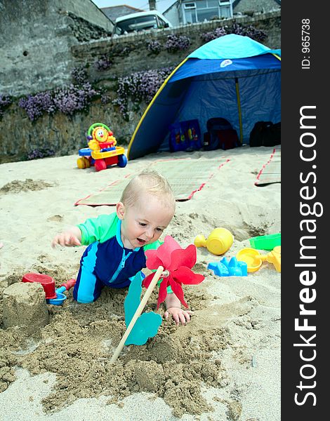 Small child exploring a beach in Cornwall. Small child exploring a beach in Cornwall.