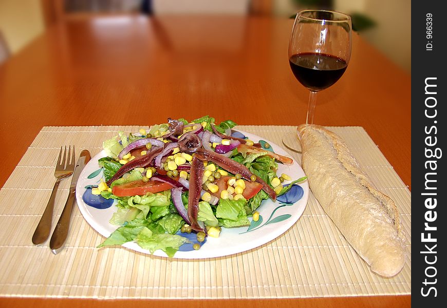 Salad whit bread and red wine. Salad whit bread and red wine