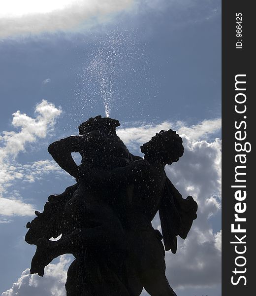 Two statue fountain in the summer sunlight