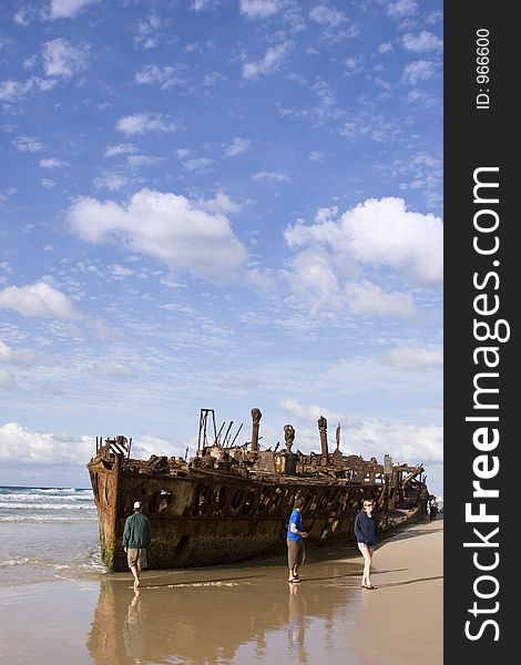 Four-wheel driving travellers check out the Maheno shipwrecks on Fraser Island in Queensland Australia. Four-wheel driving travellers check out the Maheno shipwrecks on Fraser Island in Queensland Australia.