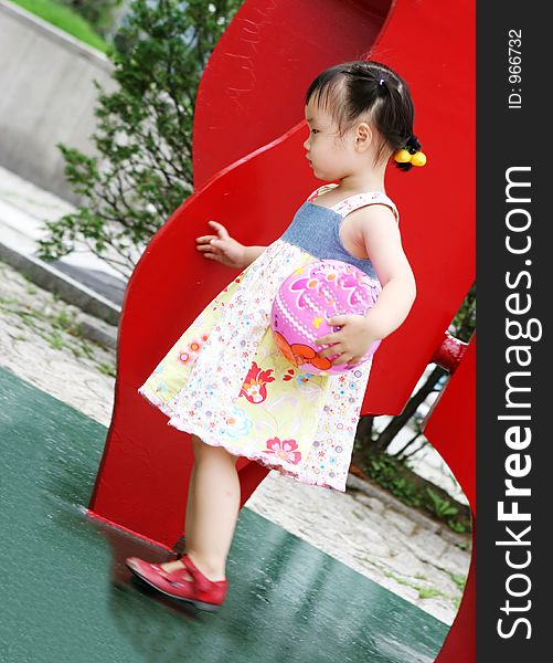 Cute Korean girl holding a ball