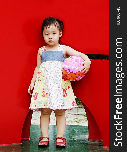 Cute Korean girl holding a ball