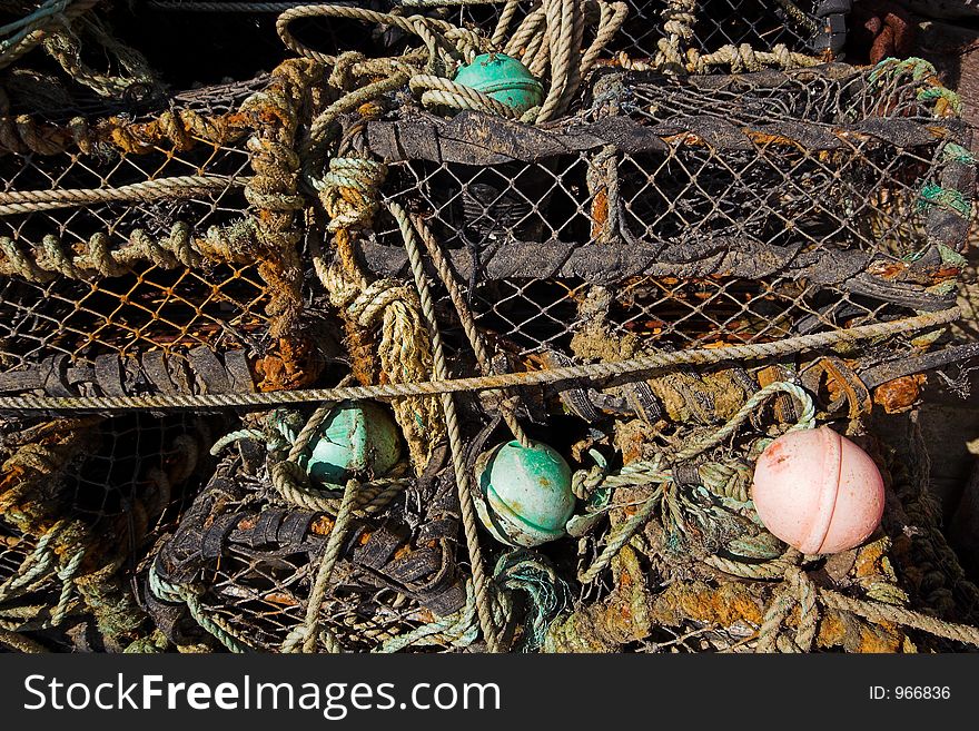 Lobster pots and rope tangled together. Lobster pots and rope tangled together.