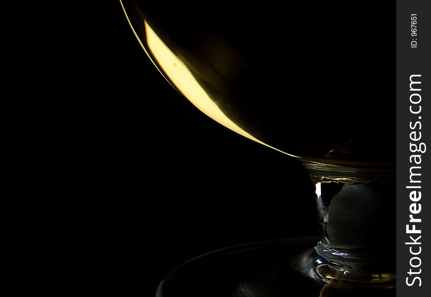 Sweet wine in glass on black background. Sweet wine in glass on black background