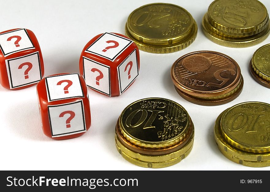 Several euro coins and dice with question simbol printed. Several euro coins and dice with question simbol printed