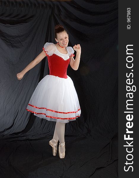 A ballerina steps out of character while on pointe to dance a different type of ballet. A ballerina steps out of character while on pointe to dance a different type of ballet.