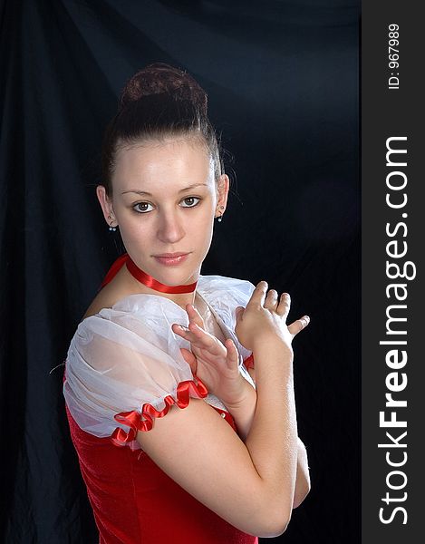 A close up portrait of a ballerina in a red and white costume. A close up portrait of a ballerina in a red and white costume