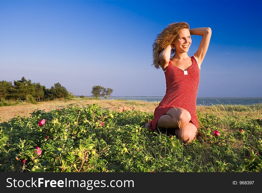 Girl sitting on a dune