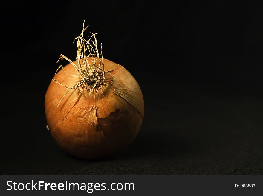Close-up of a onion in black background. Close-up of a onion in black background