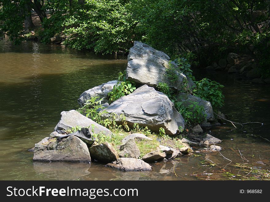 Rocks piled in lake. Rocks piled in lake