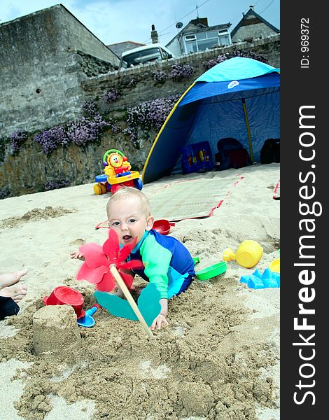 Small child exploring a beach in Cornwall. Small child exploring a beach in Cornwall.