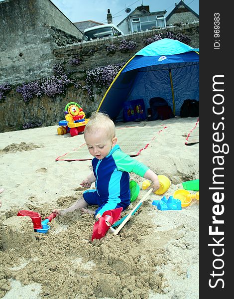 Small child exploring a beach in Cornwall. Small child exploring a beach in Cornwall.
