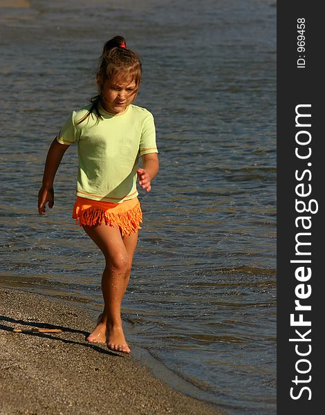 Little girl running on beach