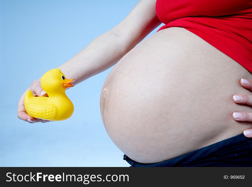 Pregnant woman with toy. Pregnant woman with toy